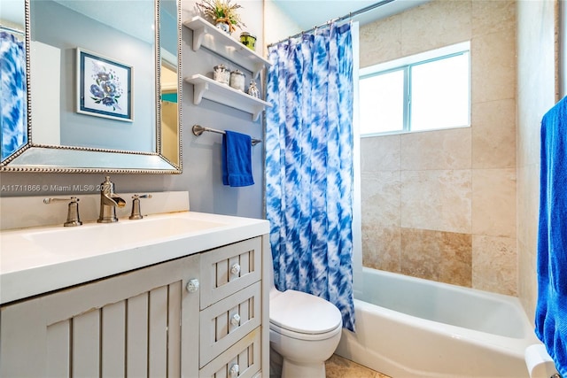 full bathroom featuring vanity, shower / bath combination with curtain, and toilet