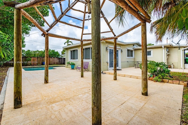 view of patio with a fenced in pool