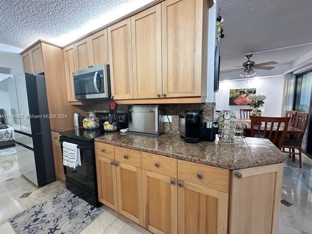 kitchen with light brown cabinets, refrigerator, ceiling fan, a textured ceiling, and black range with electric cooktop