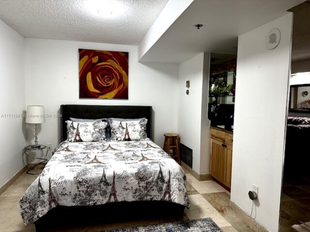 bedroom with a textured ceiling