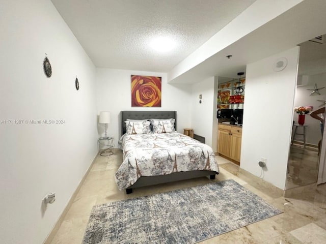 bedroom with a textured ceiling