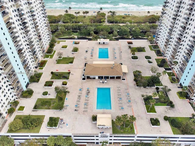 bird's eye view with a water view and a view of the beach