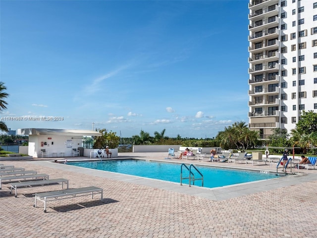 view of swimming pool with a patio area