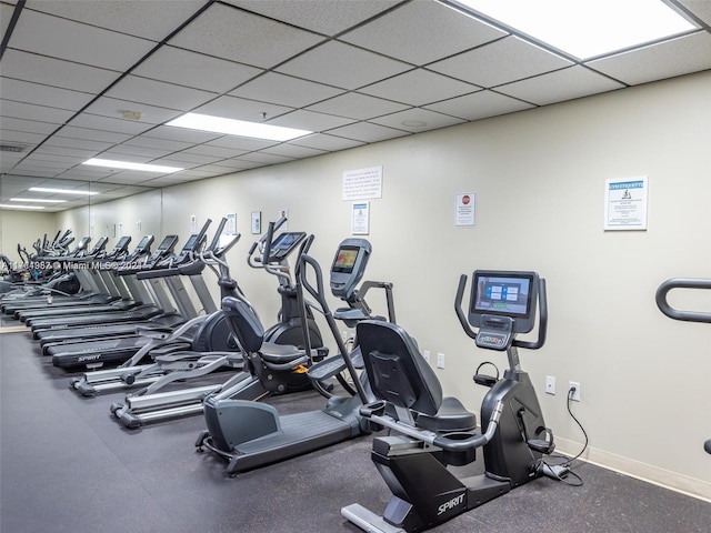 exercise room featuring a paneled ceiling