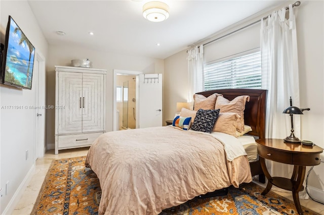 bedroom featuring ensuite bath