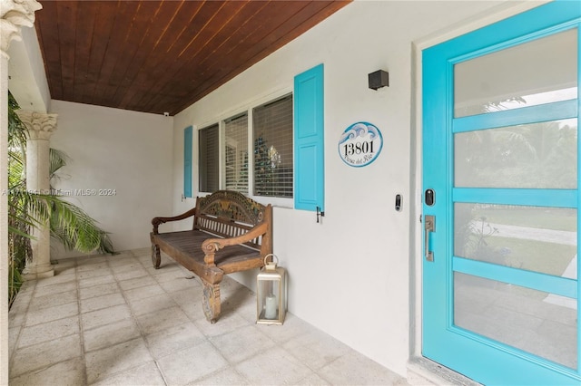 doorway to property featuring a porch