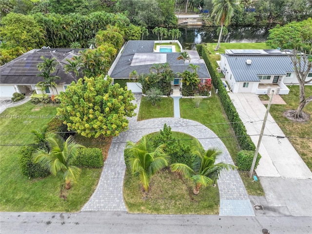 birds eye view of property with a water view