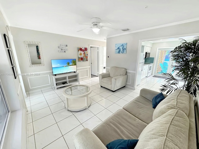 1820 SW 11th Ct, Fort Lauderdale, FL 33312 - living area with a decorative wall, a ceiling fan, wainscoting, light tile patterned floors, and ornamental molding