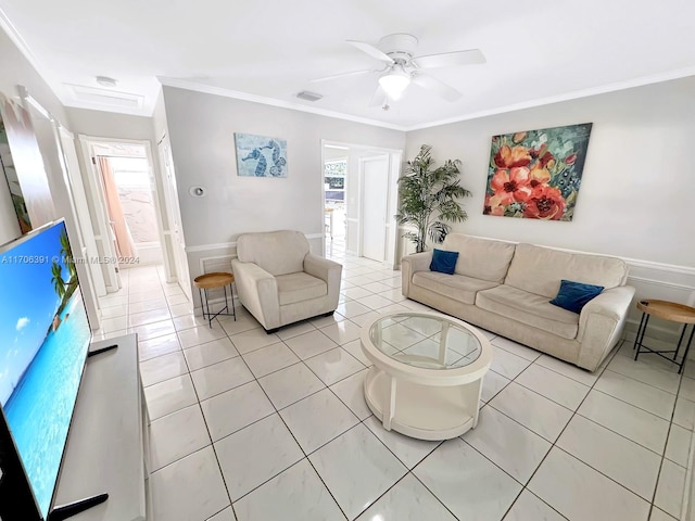 tiled living room with plenty of natural light and ornamental molding