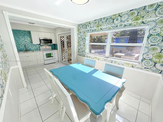 dining room with sink and light tile patterned floors