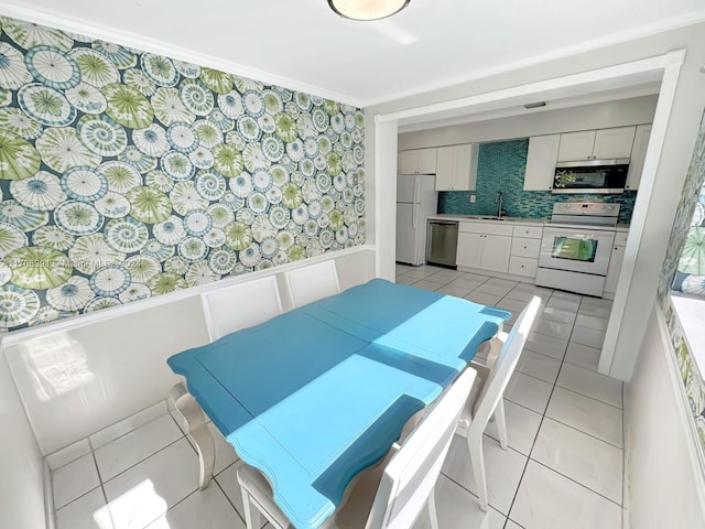 1820 SW 11th Ct, Fort Lauderdale, FL 33312 - dining space featuring light tile patterned floors and wainscoting