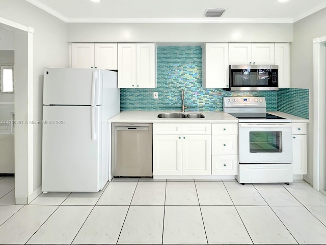 1820 SW 11th Ct, Fort Lauderdale, FL 33312 - kitchen featuring stainless steel appliances, light countertops, crown molding, tasteful backsplash, and white cabinetry