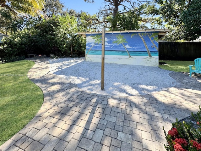 view of pool with a yard and a patio