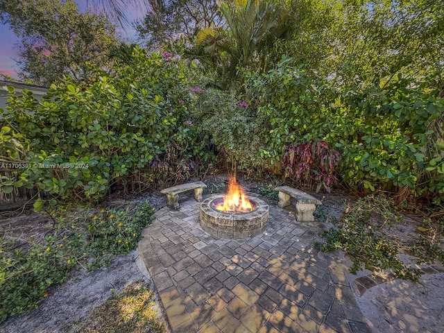 1820 SW 11th Ct, Fort Lauderdale, FL 33312 - patio terrace at dusk featuring a fire pit and a patio
