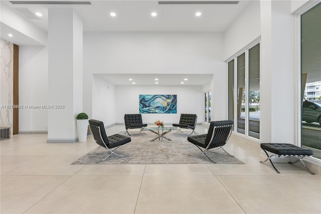 living room with a high ceiling