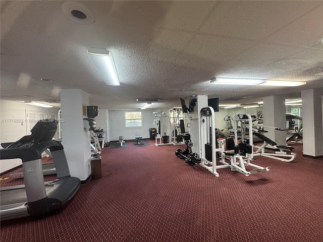 exercise room featuring a textured ceiling