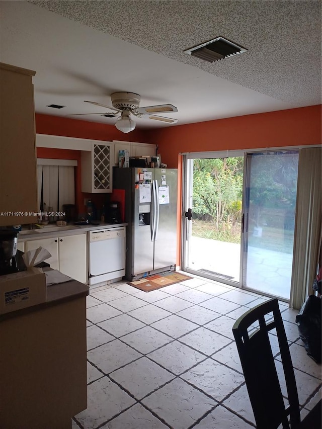 kitchen featuring dishwasher, stainless steel fridge with ice dispenser, white cabinets, and ceiling fan