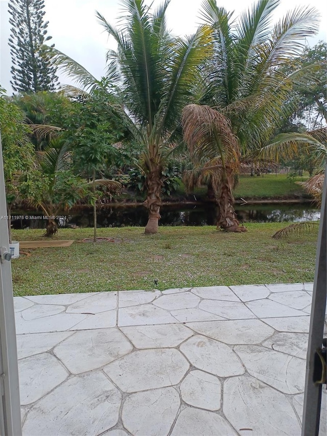 view of patio with a water view