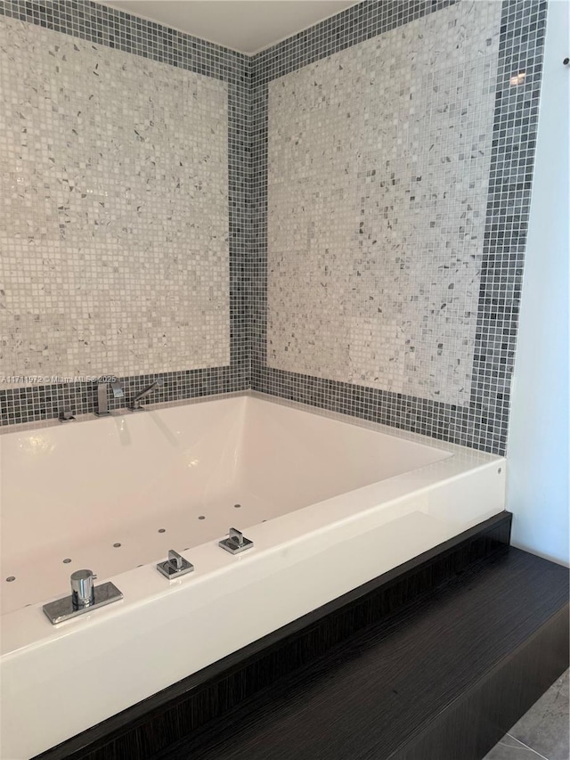 full bathroom featuring tile patterned flooring and a bath