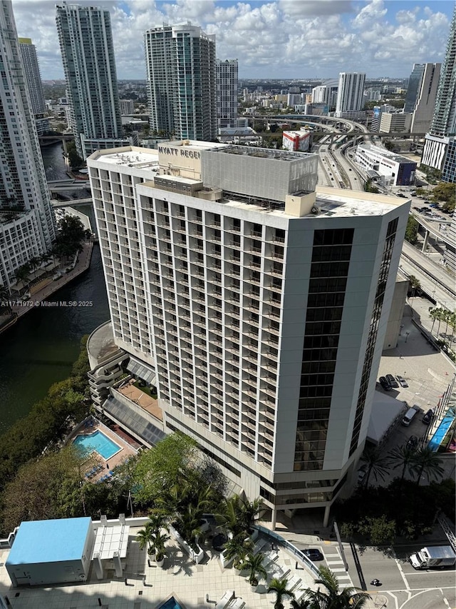 exterior space with a water view and a view of city