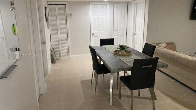 dining area with light tile patterned flooring