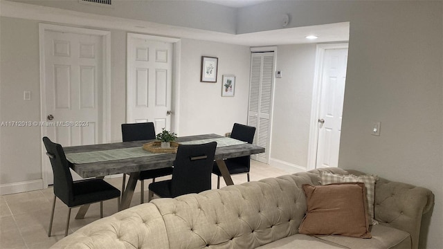 dining area featuring light tile patterned floors