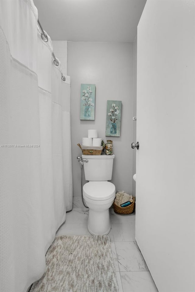 bathroom featuring toilet