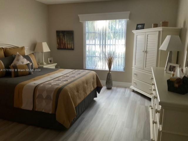 bedroom featuring light hardwood / wood-style floors