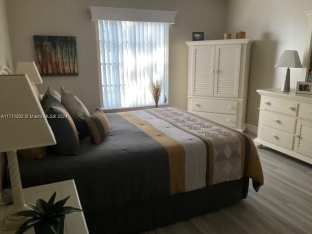 bedroom with wood-type flooring