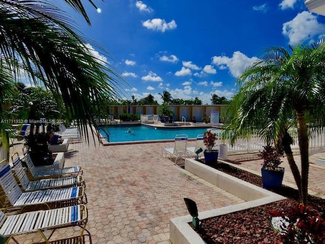 view of swimming pool featuring a patio