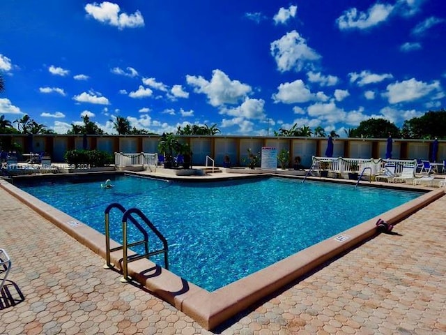 view of swimming pool with a patio area