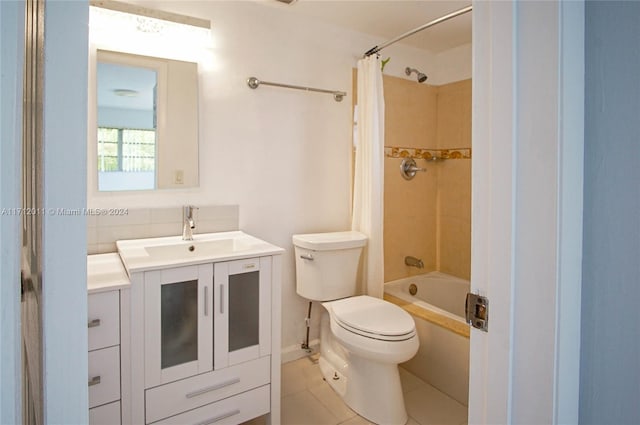 full bathroom featuring toilet, shower / bath combo, vanity, and tile patterned floors