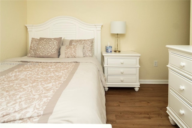 bedroom featuring dark wood-type flooring