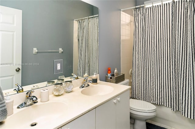 full bathroom featuring tile patterned flooring, vanity, toilet, and shower / bathtub combination with curtain