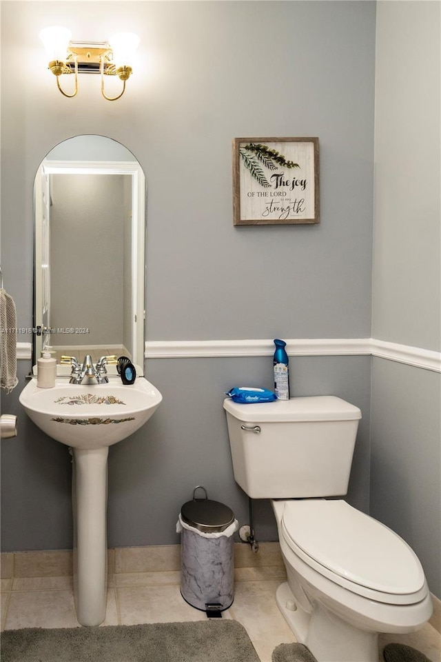 bathroom featuring tile patterned flooring and toilet