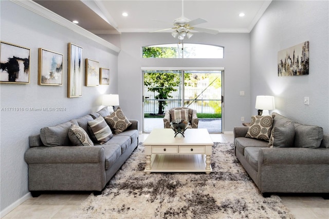 tiled living room with ceiling fan and crown molding