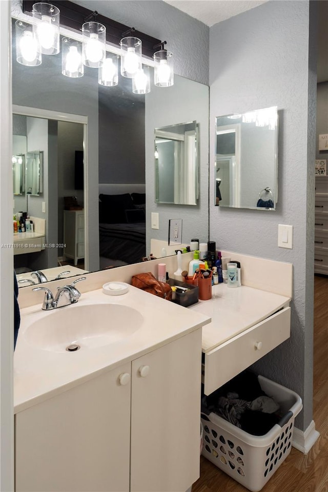 bathroom with wood-type flooring and vanity