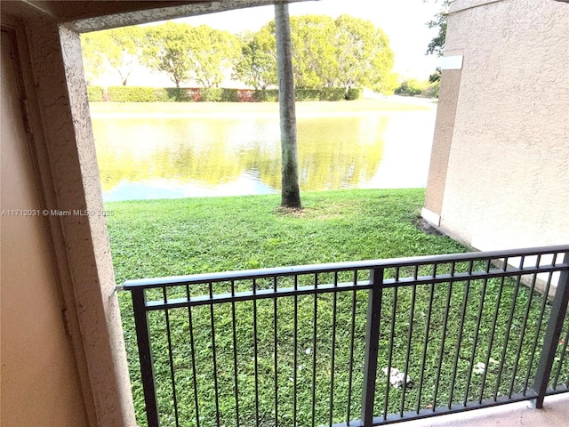 exterior space featuring a water view and a balcony