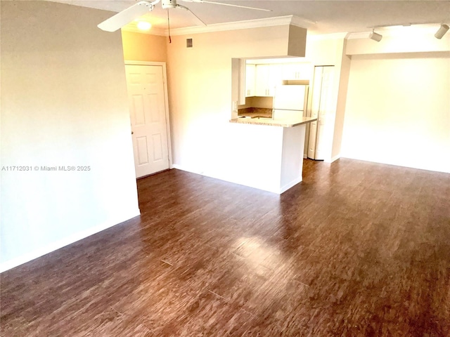 interior space featuring dark wood-style floors, ceiling fan, and ornamental molding