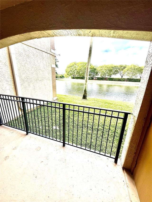 balcony featuring a water view