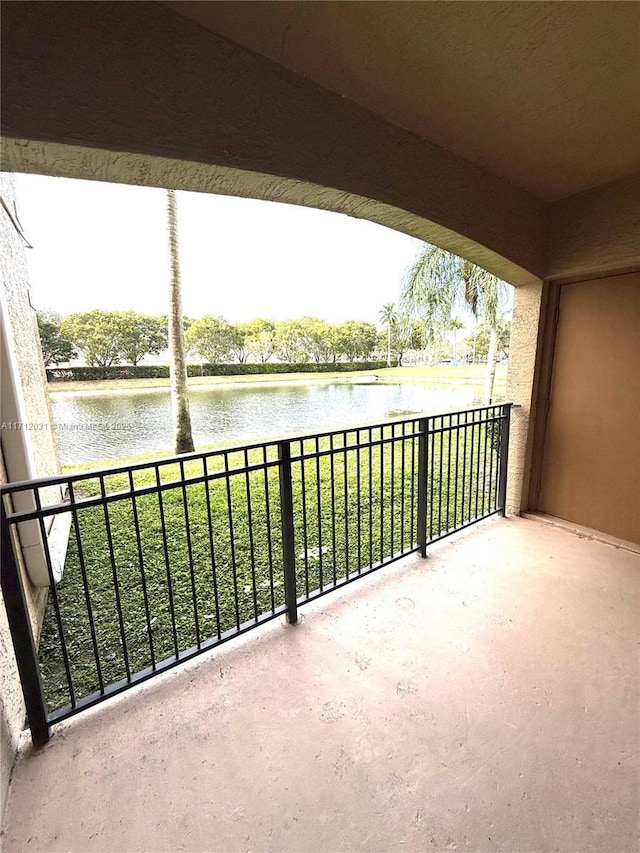 balcony featuring a water view