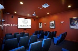 cinema room featuring crown molding, visible vents, and recessed lighting