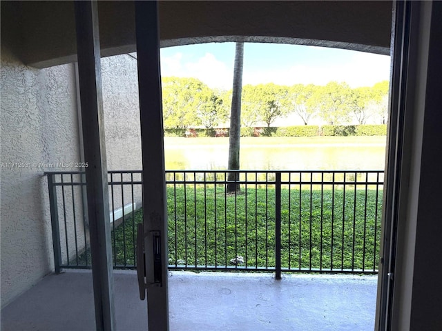 balcony featuring a water view