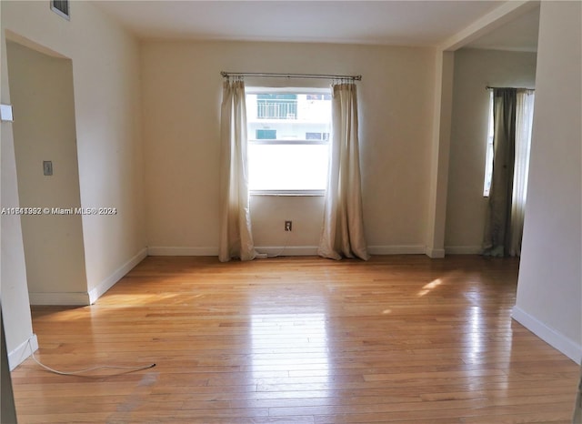 unfurnished room featuring light wood-type flooring