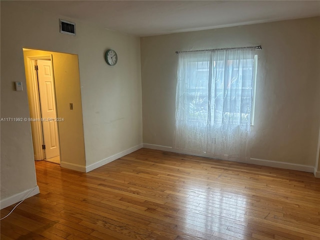 empty room with light hardwood / wood-style floors