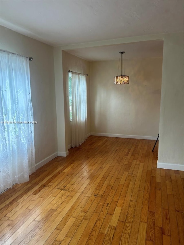 unfurnished dining area with light hardwood / wood-style flooring