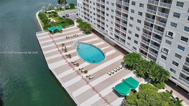 birds eye view of property with a water view