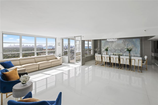 tiled living room featuring expansive windows