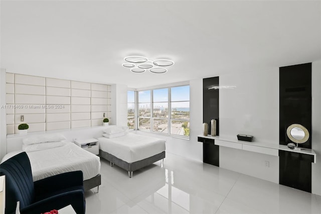 bedroom with light tile patterned floors