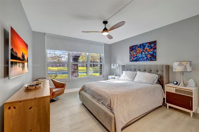 bedroom featuring hardwood / wood-style flooring and ceiling fan